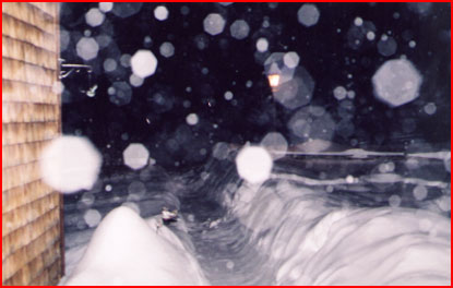 Snow falling at night